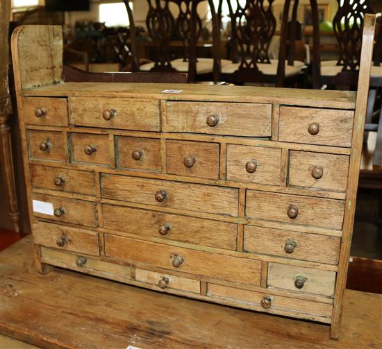 A part painted wood cabinet of drawers
